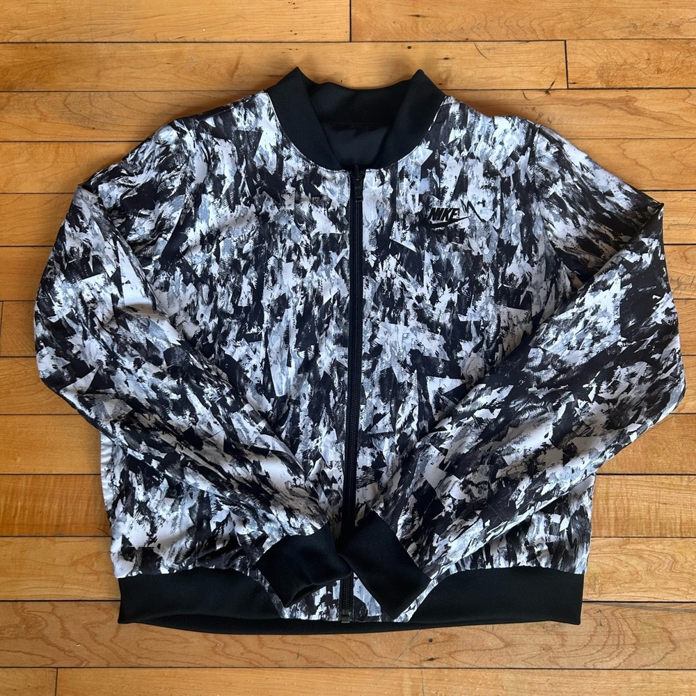 A3. Nike Reversible Jacket. Matching Pants Sold Separately.